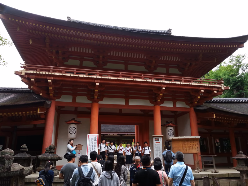 A group of people is playing music in front of a traditional Japanese building.