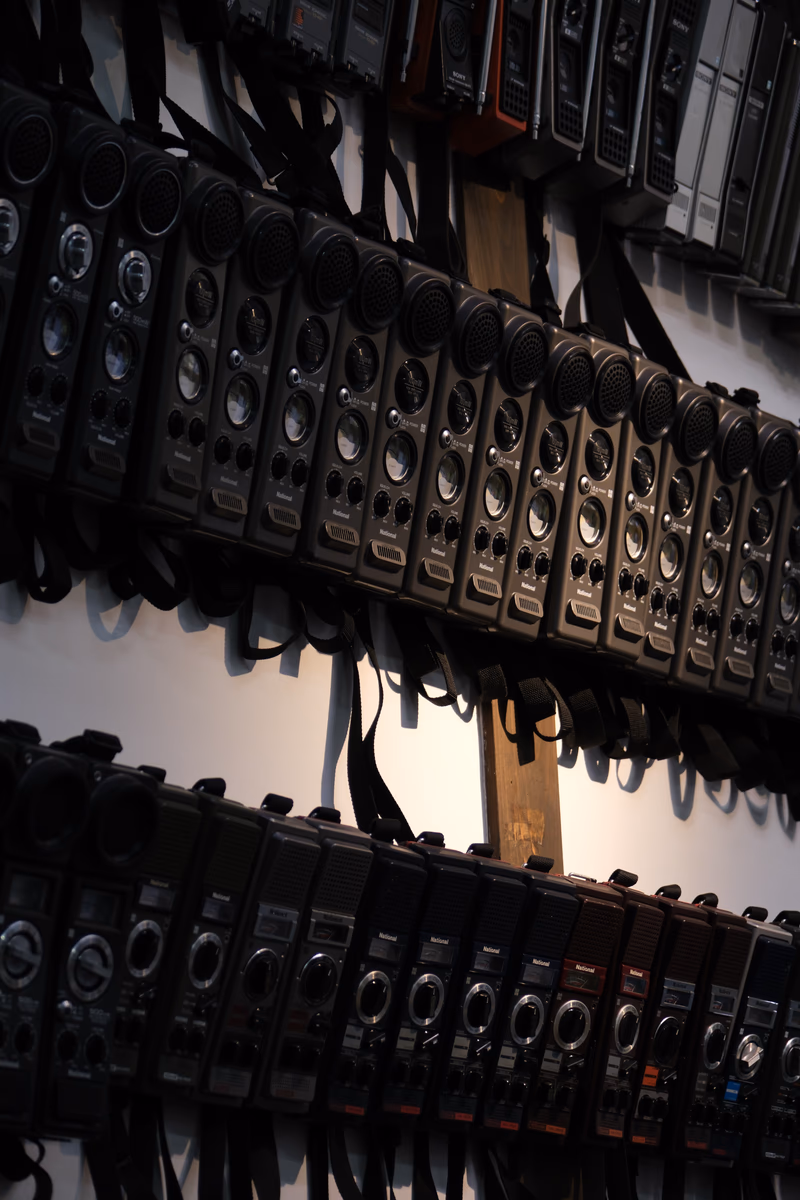 A photo of speakers mounted on a ceiling