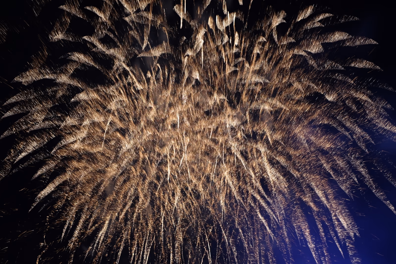 A photo of fireworks exploding in the night sky over Asahikawa, Hokkaido, Japan.