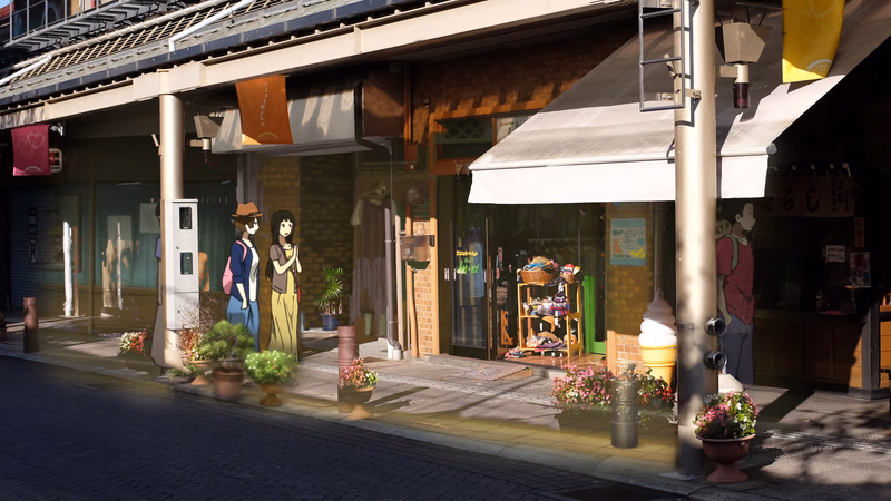 A row of Japanese shopfronts with awnings lines a sidewalk, featuring mannequins and display windows.