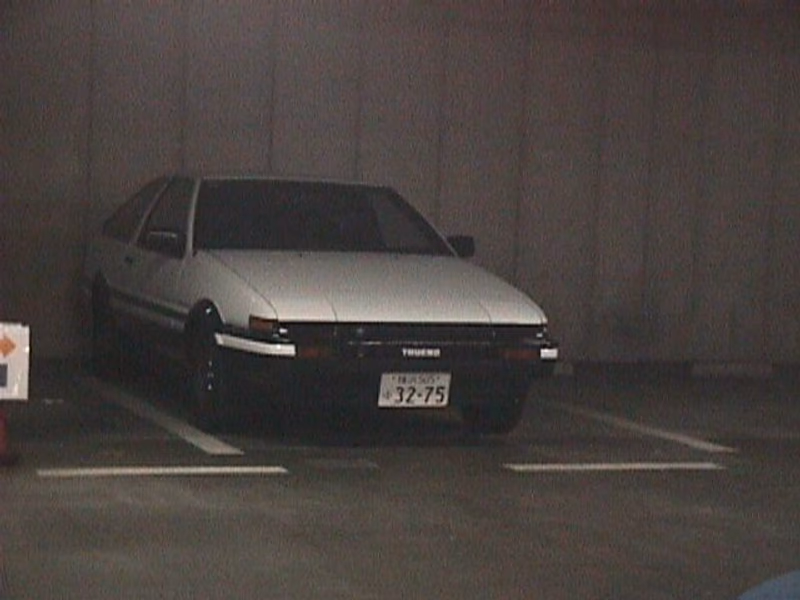 A white car in a parking lot