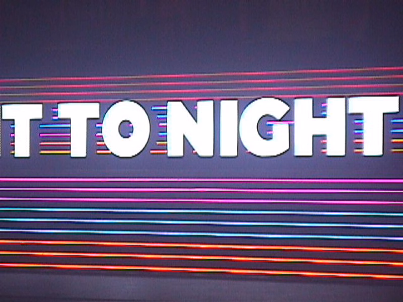 A digital display shows the text "T TO NIGHT" over a background of colorful horizontal lines.