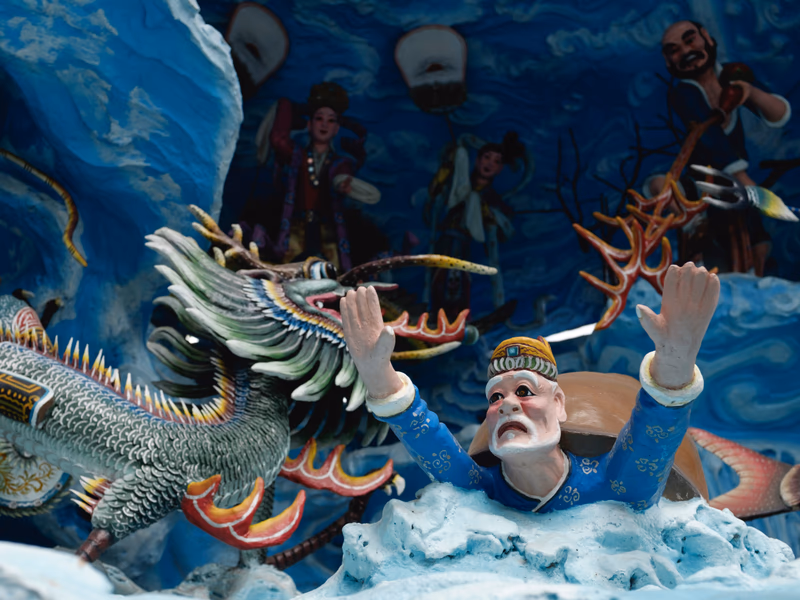 A scene from Chinese mythology featuring a dragon and a figure in traditional Chinese attire.