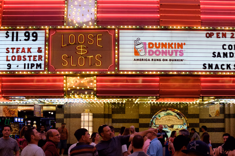 A vibrant night scene at a lively food and entertainment venue in Las Vegas, Nevada.