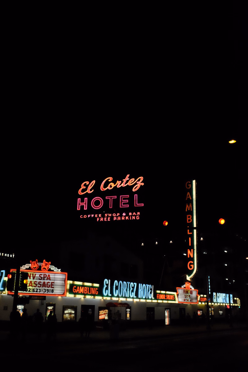 A nighttime view of the El Cortez Hotel sign, which reads "El Cortez HOTEL" and "GAMBLING".